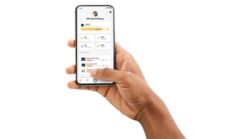 A hand holding a smartphone displaying a profile screen with user information, level progress, and various app statistics.