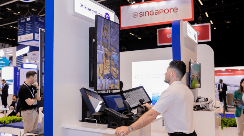 A man operates a control system at a trade show booth with a 