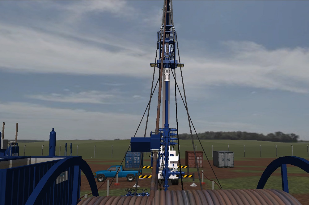 A drilling rig is set up in a field with machinery, a truck, and storage containers nearby under a cloudy sky.