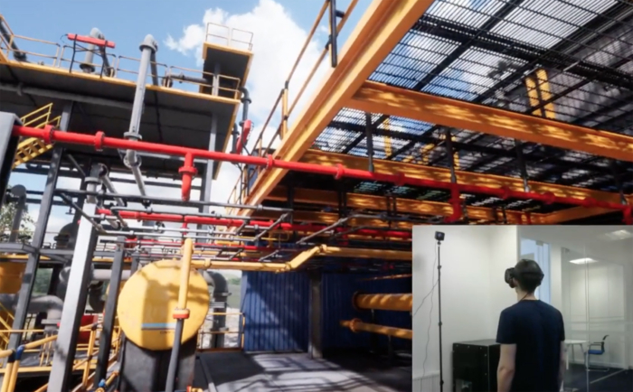 A person wearing a VR headset is immersed in a virtual industrial environment showcasing machinery, yellow tanks, and red pipelines.