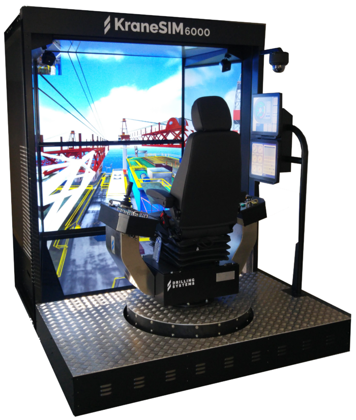 A crane operation simulator with a seat, control panel, and multiple display screens providing a virtual construction site view for training purposes.