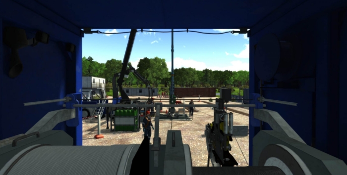View from inside industrial equipment looking out to a construction site with machinery, vehicles, and trees in the background on a clear day.