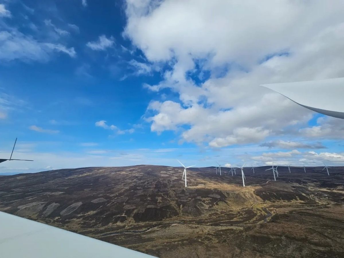 View of the countryside with wind turbines from on the top of a turbine.