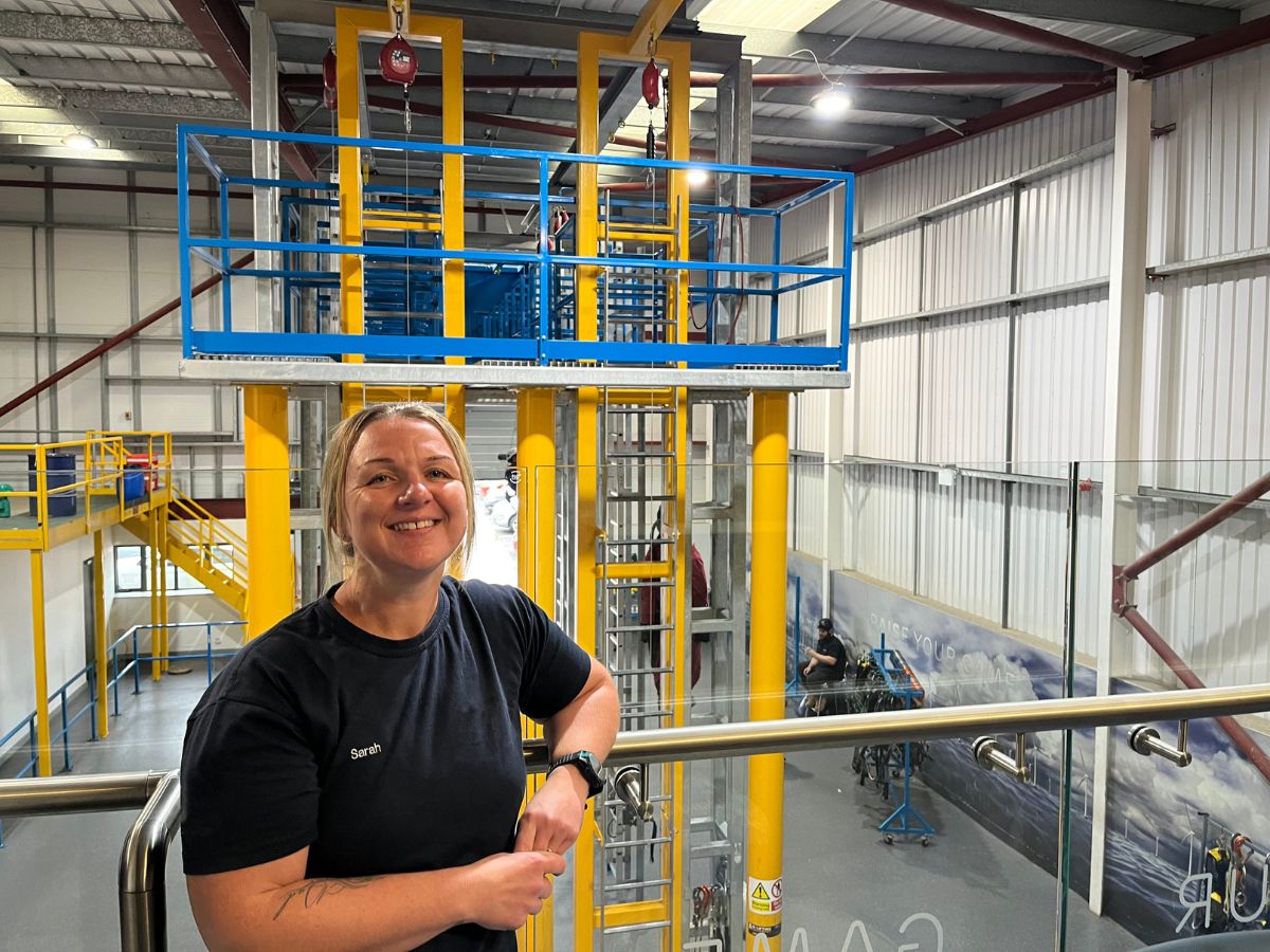 3t instructor in a navy t-shirt in front of the GWO wind training centre.